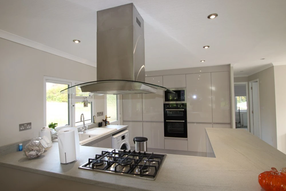 A Completed Open Plan Peninsula Kitchen With New Appliances
